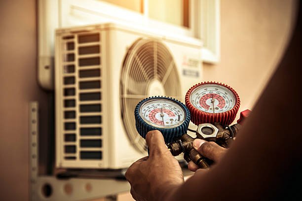 Professional Air Conditioning Service technician working in Rosharon, TX